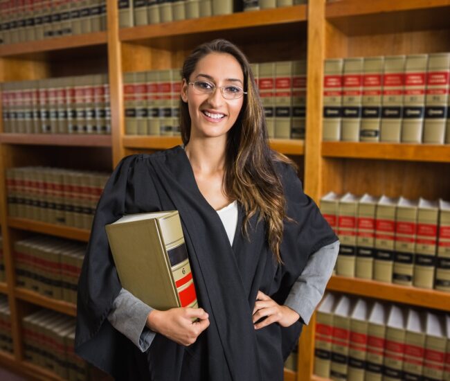 Pretty,Lawyer,Looking,At,Camera,In,The,Law,Library,At